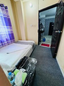 Postel nebo postele na pokoji v ubytování Hotel Ebraj Sylhet