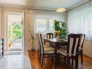 a dining room with a table and chairs at Holiday Home Nádor - FOD125 by Interhome in Fehérbézseny