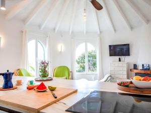 a dining room with a table with fruits on it at Holiday Home Villa Sol by Interhome in Calpe