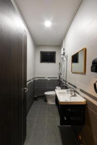a bathroom with a toilet and a sink at Miền Sương Khói Homestay Đà Lạt in Da Lat +82 photos
