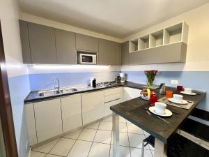 Η κουζίνα ή μικρή κουζίνα στο Holiday Home Ville Rio-3 by Interhome