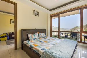 Ένα ή περισσότερα κρεβάτια σε δωμάτιο στο 2BHK Furnished Apartment/Near Kasauli/Barog/Luv Fun & Adventure