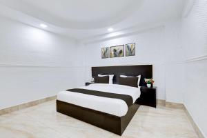 Postel nebo postele na pokoji v ubytování Hotel O Grand Heights