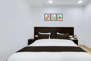 Postel nebo postele na pokoji v ubytování Hotel O Grand Heights