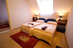 Posteľ alebo postele v izbe v ubytovaní Piknik Wellness Hotel