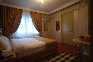 Postel nebo postele na pokoji v ubytování Mini Hotel