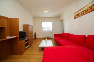 A television and/or entertainment centre at Apartmánový Dom River