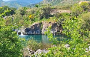 a view of a river with a waterfall at Gorgeous Home In Motta Camastra in Motta Camastra