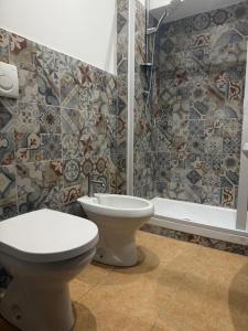 Koupelna v ubytování Clarian Affittacamere + 52 fotografií