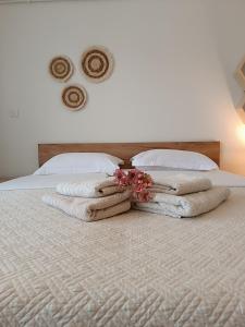 A bed or beds in a room at Sea View Palio Apartment