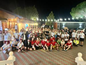 a large group of people posing for a picture at Kamberi Hotel & Apartments in Velipojë