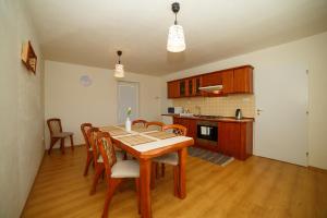 A kitchen or kitchenette at Apartmánový Dom River