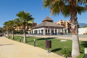 a park with a gazebo and palm trees at Estepona East Apartment MAEWEST in Estepona
