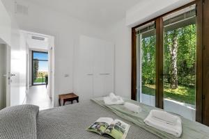 Postel nebo postele na pokoji v ubytování Aquavista - Happy Rentals