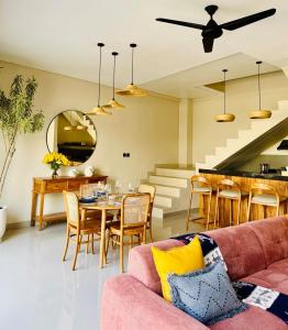 a living room with a couch and a table at Cozy Living Kalos Villa in Kerobokan