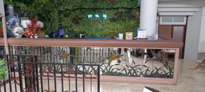 a fence in front of a green wall at Hotel O Kebayoran in Jakarta +32 photos