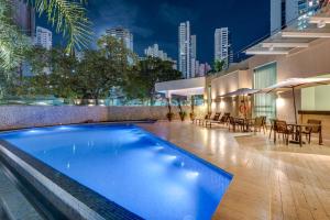 a swimming pool in the middle of a building at K Hotel in Goiânia