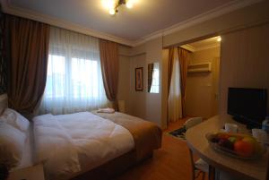 Postel nebo postele na pokoji v ubytování Mini Hotel
