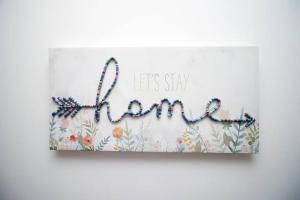 a sign that says lets stay mum on a wall at City Centre, Parking, Smart Tv's in all rooms in Swansea +24 photos