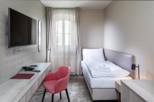 TV a/nebo společenská místnost v ubytování Esplanade, dependance hotelu Monti Spa