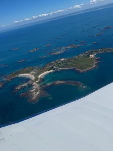 an island in the middle of the ocean at Les 3 couronnes in Granville +2 photos