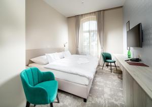 Postel nebo postele na pokoji v ubytování Esplanade, dependance hotelu Monti Spa