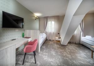 Postel nebo postele na pokoji v ubytování Esplanade, dependance hotelu Monti Spa