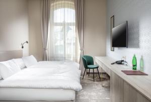 Postel nebo postele na pokoji v ubytování Esplanade, dependance hotelu Monti Spa