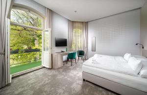 Postel nebo postele na pokoji v ubytování Esplanade, dependance hotelu Monti Spa