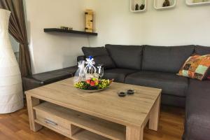 a living room with a couch and a coffee table at Ferienhaus Für 2 Personen Ca 35 M Sup2 In Seegebiet Mansfelder Land Seeburg, Sachsen Anhalt Mansfelder Land in Seeburg