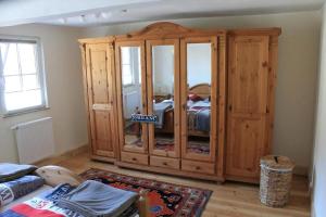 a large wooden cabinet in a living room at Festung Zu Ketghe in Kettig +7 photos