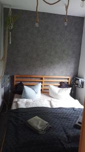 a bedroom with a large bed with white pillows at Butje in Zinnowitz