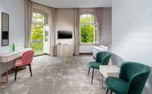 TV a/nebo společenská místnost v ubytování Esplanade, dependance hotelu Monti Spa