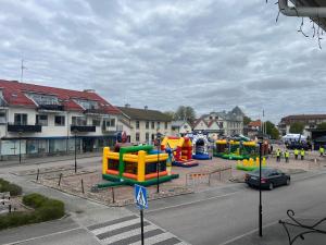 a parking lot with a playground in a city at Charlines cozy Pensionat in Svenljunga