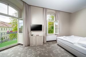 Postel nebo postele na pokoji v ubytování Esplanade, dependance hotelu Monti Spa