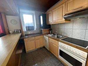 Kuchyň nebo kuchyňský kout v ubytování Wohnung 3 Im 1 Og + 9 fotografií