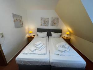 Postel nebo postele na pokoji v ubytování Westhüs 14 + 22 fotografií