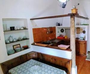 a kitchen with a sink and a counter top at Palazzo Caracciolo in Gerace