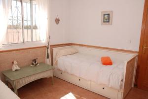 Łóżko lub łóżka w pokoju w obiekcie Villa 3 A