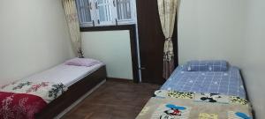 A bed or beds in a room at Diyalo Home