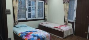 A bed or beds in a room at Diyalo Home