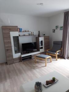 TV a/nebo společenská místnost v ubytování Ferienhaus Möwe 16