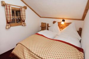 a bedroom with a bed and a window at Ruhiges Appartement In St Gallenkirch in Sankt Gallenkirch +18 photos