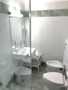 a bathroom with a sink and a toilet and a mirror at Ferienwohnung Design Chalet In Bad Kleinkirchheim in Bad Kleinkirchheim
