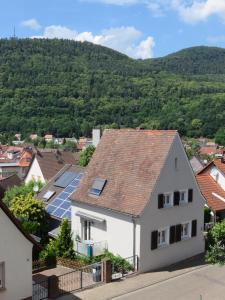a view of a house with solar panels on the roof at Ferienhaus Trifels in Annweiler am Trifels