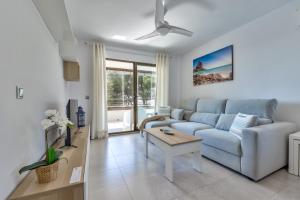a living room with a couch and a table at Villas Guzman - Paraiso Mar in Calpe