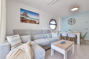 a living room with a couch and a table at Villas Guzman - Paraiso Mar in Calpe