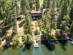 an aerial view of a house on a lake at The Big Easy Lakefront Cabin in Groveland
