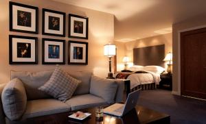 a hotel room with a couch and a bed at Marcliffe in Aberdeen