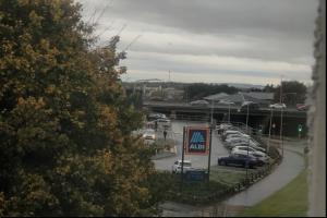 a bunch of cars parked in a parking lot at 2 Bed & 2 Bath-Flat-Driving Distance to Edinburgh in Uphall